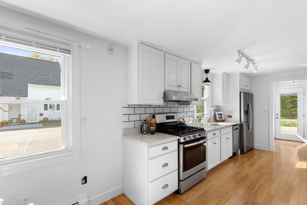 12 State Road, Unit 3D Plymouth, MA 02360 - Photo 8 of 30 a kitchen with stainless steel appliances white cabinets and a window