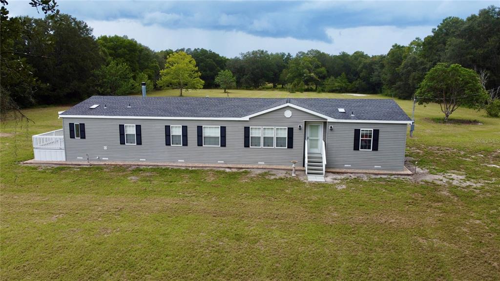 1070 Southwest Mauldin Avenue Lake City, FL 32024 - Photo 1 of 31 a aerial view of a house next to a big yard and large trees