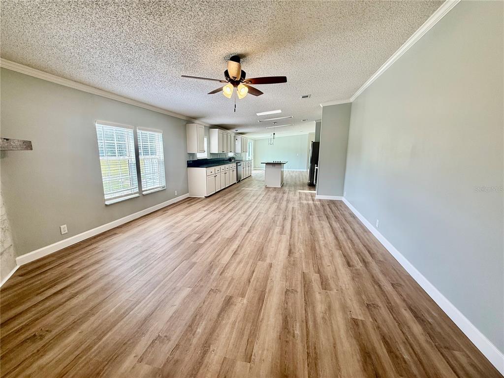 1070 Southwest Mauldin Avenue Lake City, FL 32024 - Photo 14 of 31 wooden floor in an empty room with a window
