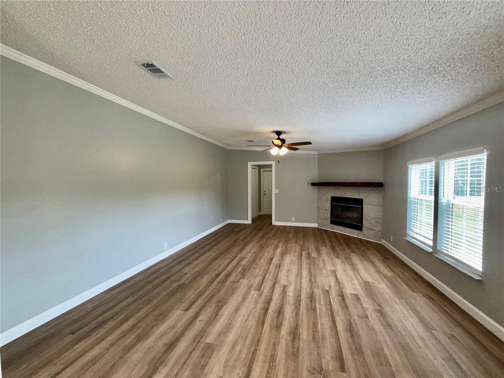 1070 Southwest Mauldin Avenue Lake City, FL 32024 - Photo 15 of 31 wooden floor in an empty room with a window