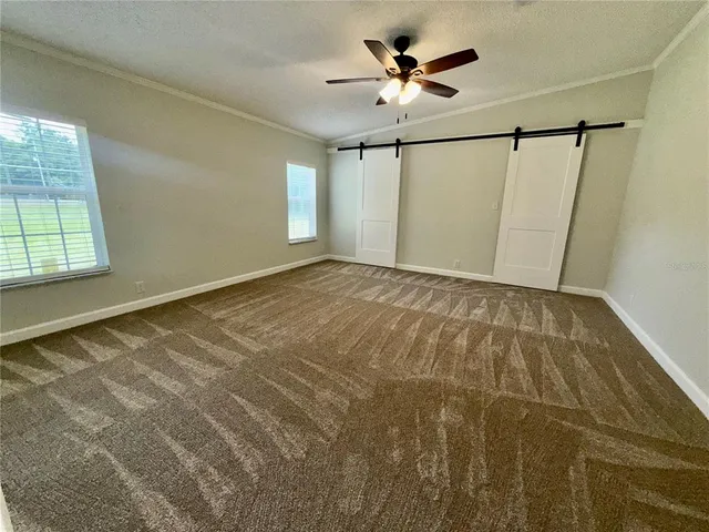 a view of an empty room with a window