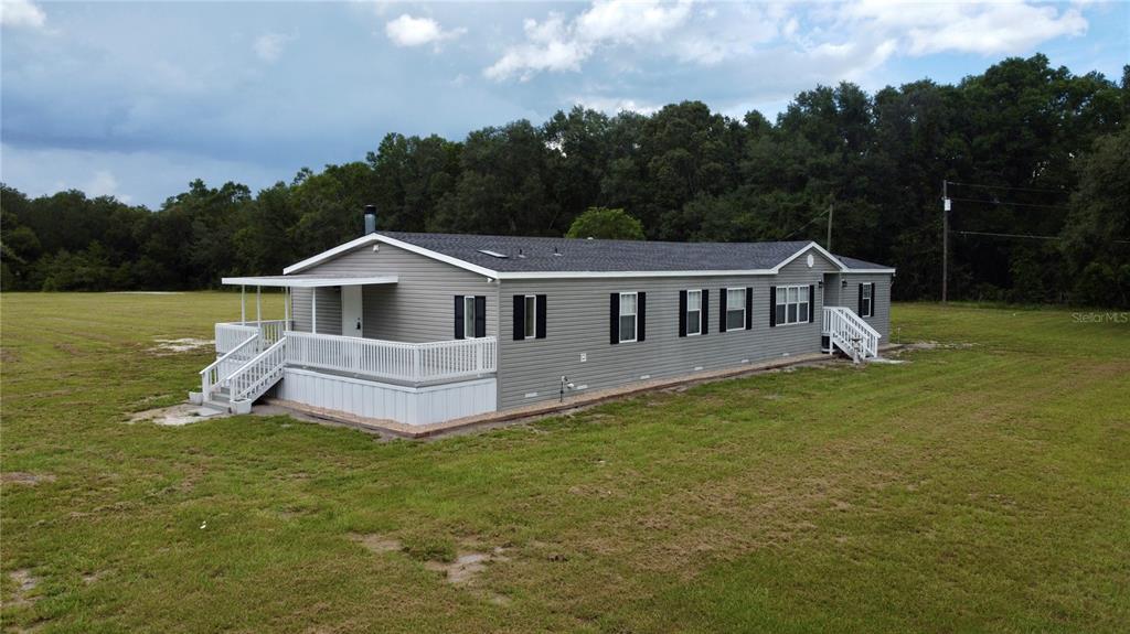 1070 Southwest Mauldin Avenue Lake City, FL 32024 - Photo 3 of 31 a view of a house with a yard and sitting area