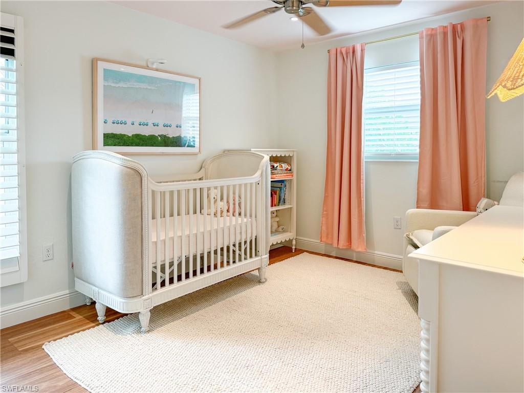 2440 Clipper Way Naples, FL 34104 - Photo 10 of 11 a view of a bedroom with furniture and windows