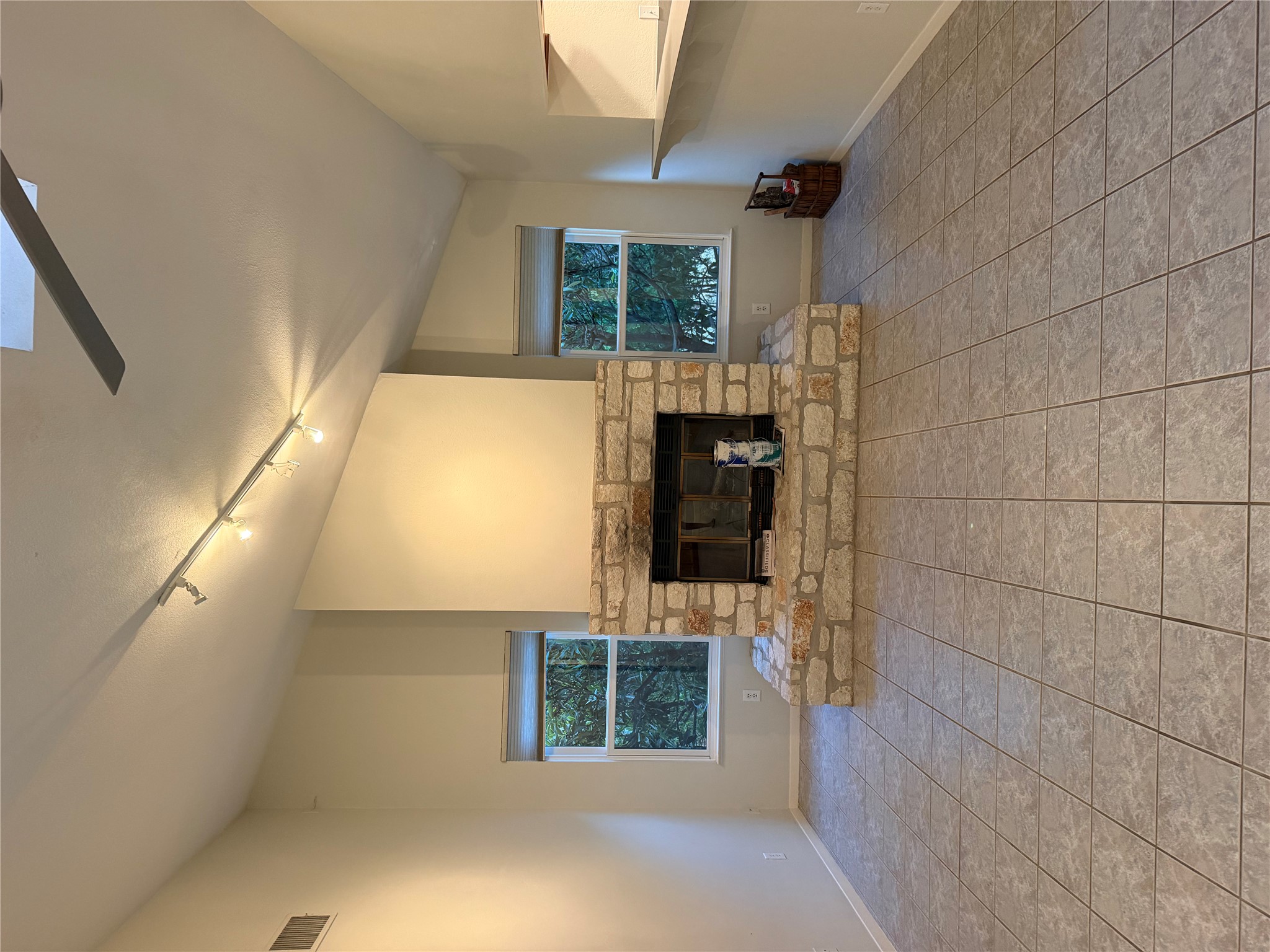 5511 Arroyo Road Austin, TX 78734 - Photo 8 of 38 Recently Painted white above fireplace; skylights let in natural light.