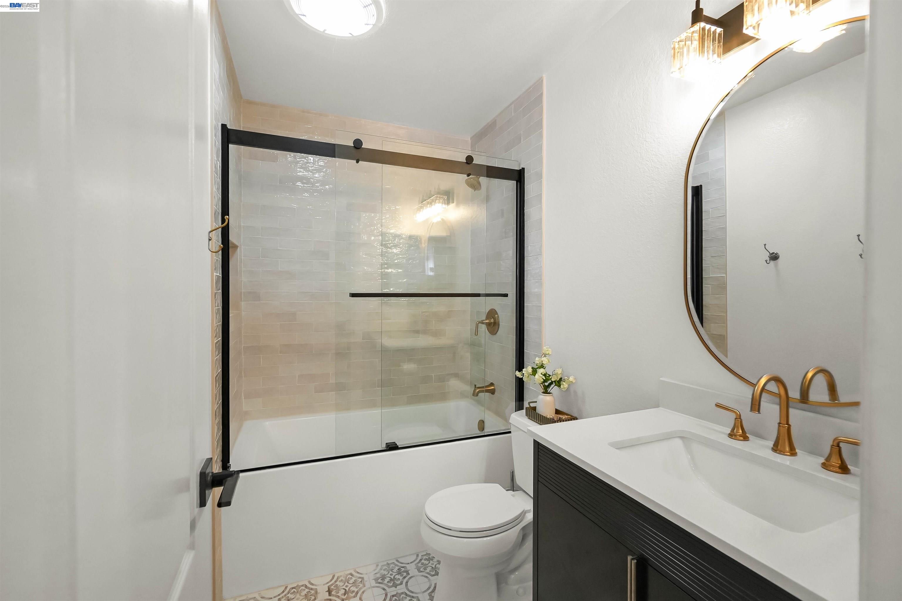 200 Reflections Drive, Unit 23 San Ramon, CA 94583 - Photo 27 of 56 a bathroom with a granite countertop sink toilet and shower