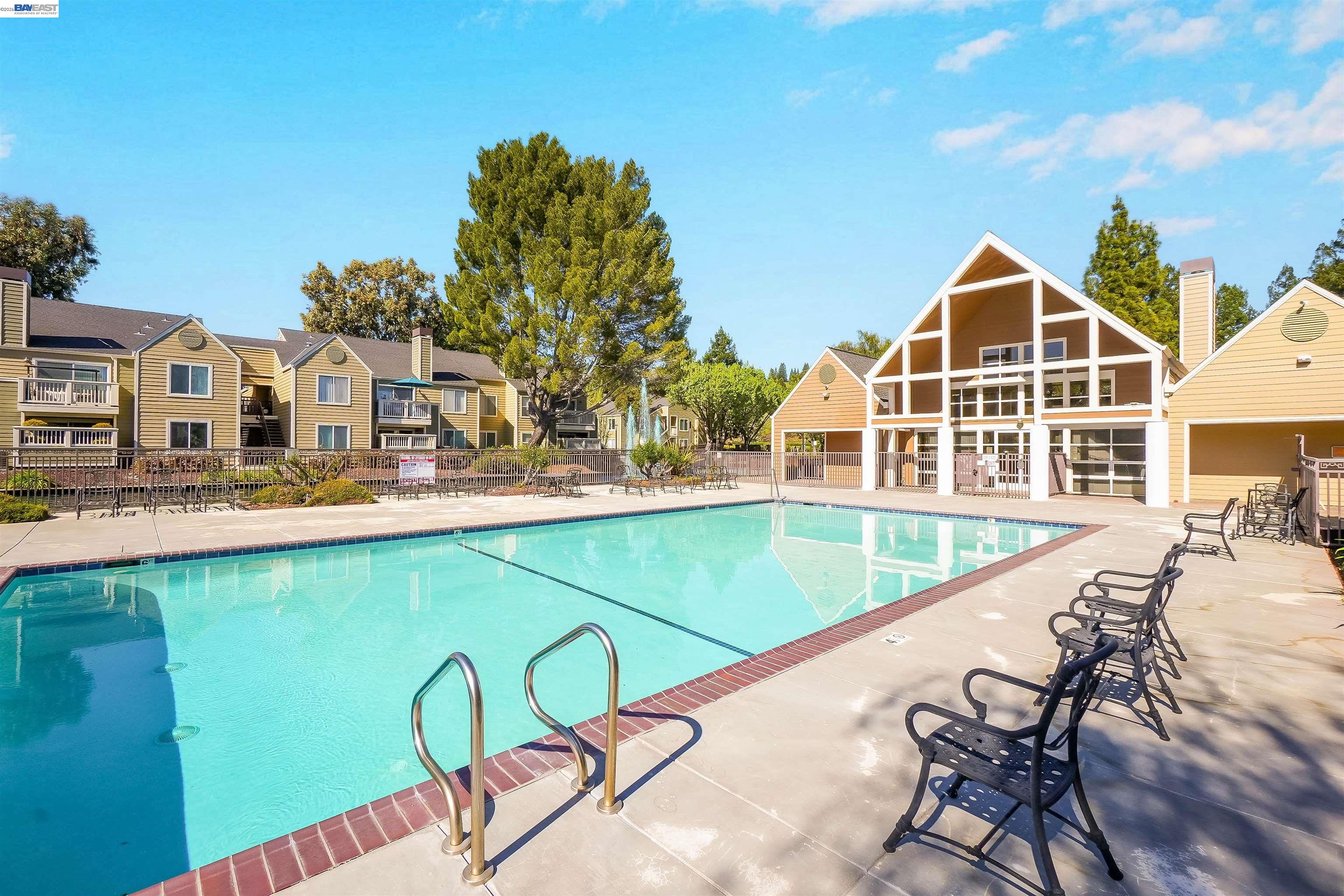 200 Reflections Drive, Unit 23 San Ramon, CA 94583 - Photo 3 of 56 a view of a swimming pool with a lounge chairs