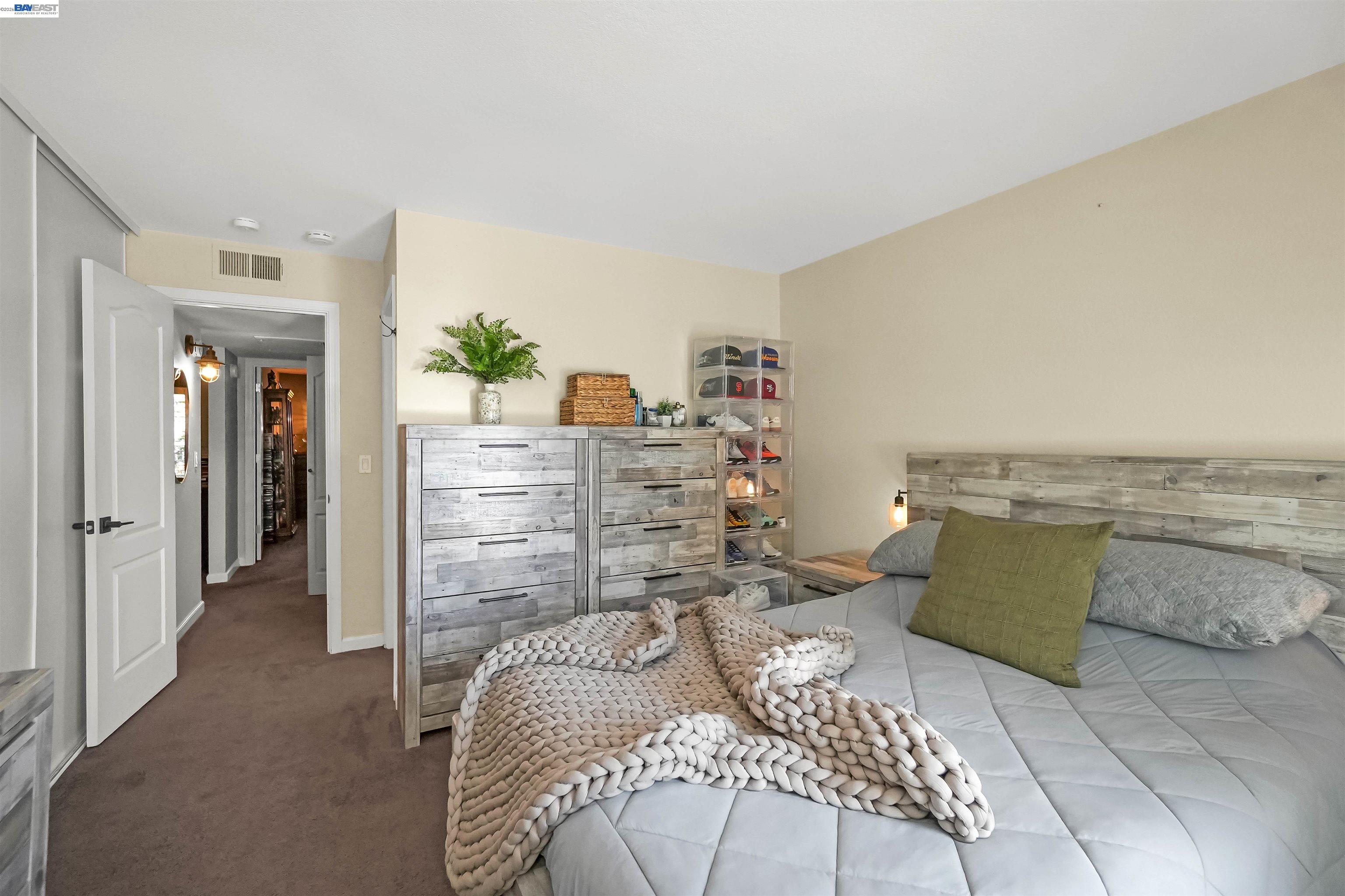 200 Reflections Drive, Unit 23 San Ramon, CA 94583 - Photo 32 of 56 a bedroom with a bed and a couch