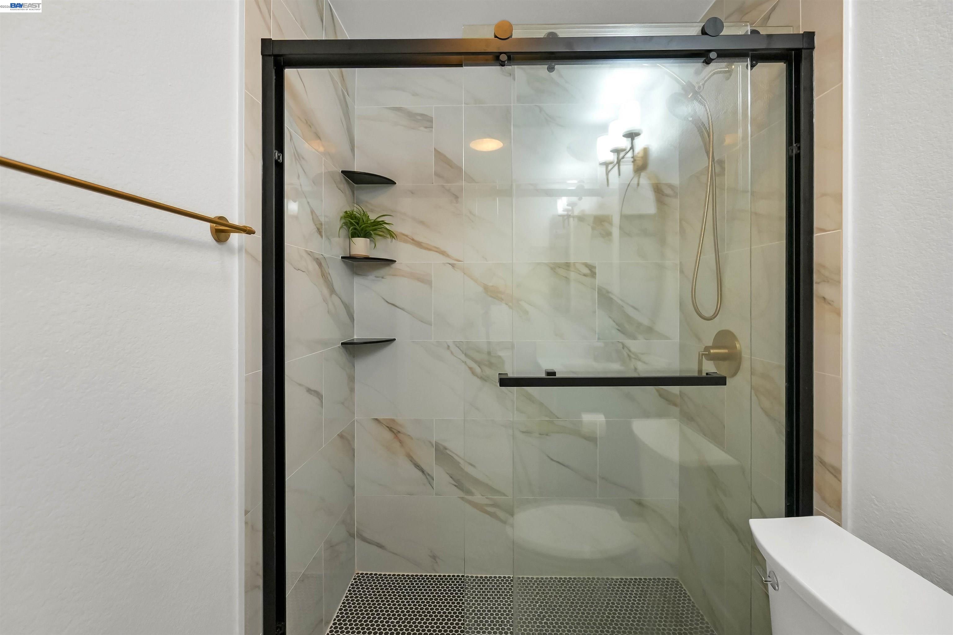 200 Reflections Drive, Unit 23 San Ramon, CA 94583 - Photo 34 of 56 a bathroom with a glass shower door