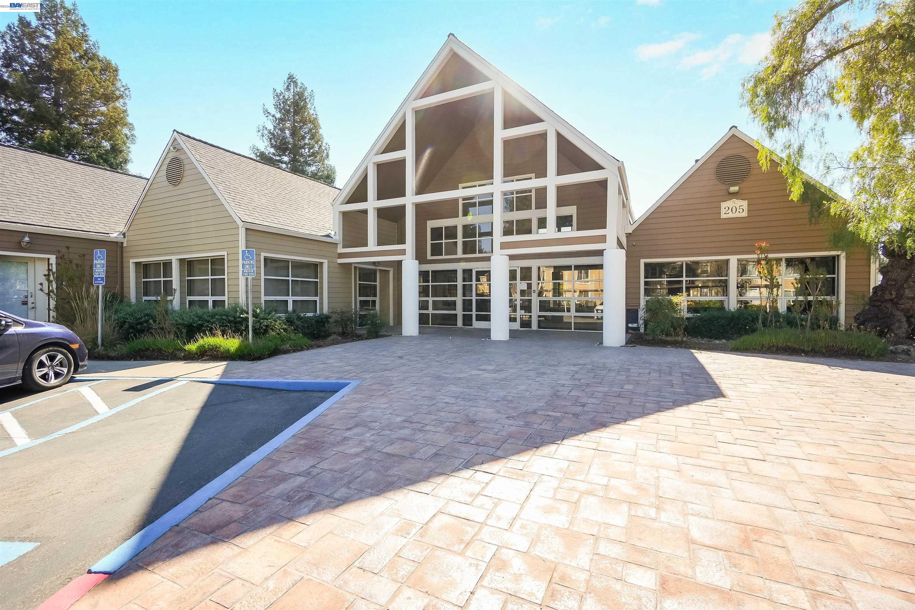 200 Reflections Drive, Unit 23 San Ramon, CA 94583 - Photo 40 of 56 a front view of a house with a yard and potted plants