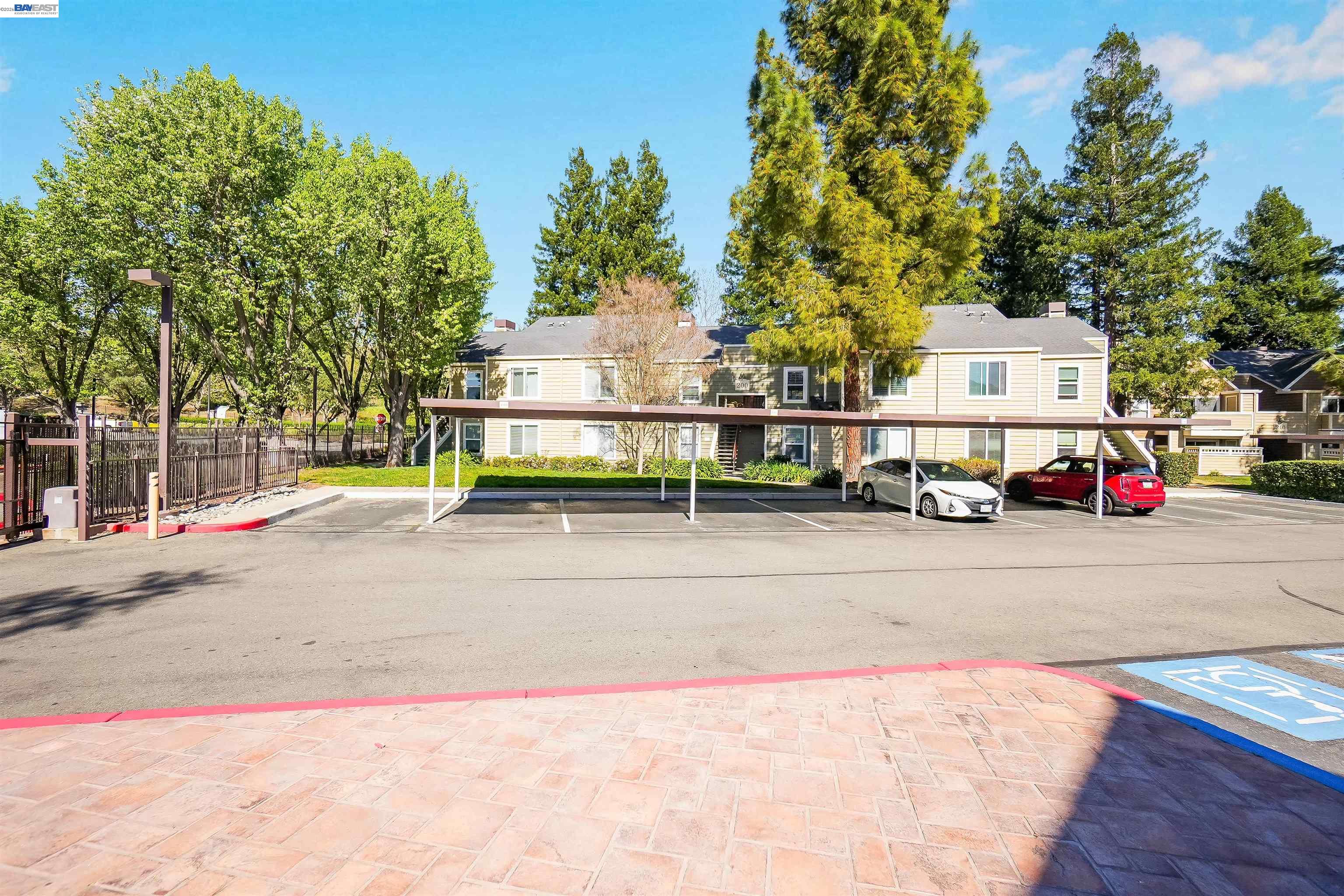 200 Reflections Drive, Unit 23 San Ramon, CA 94583 - Photo 42 of 56 a white house that has a tree in front of it