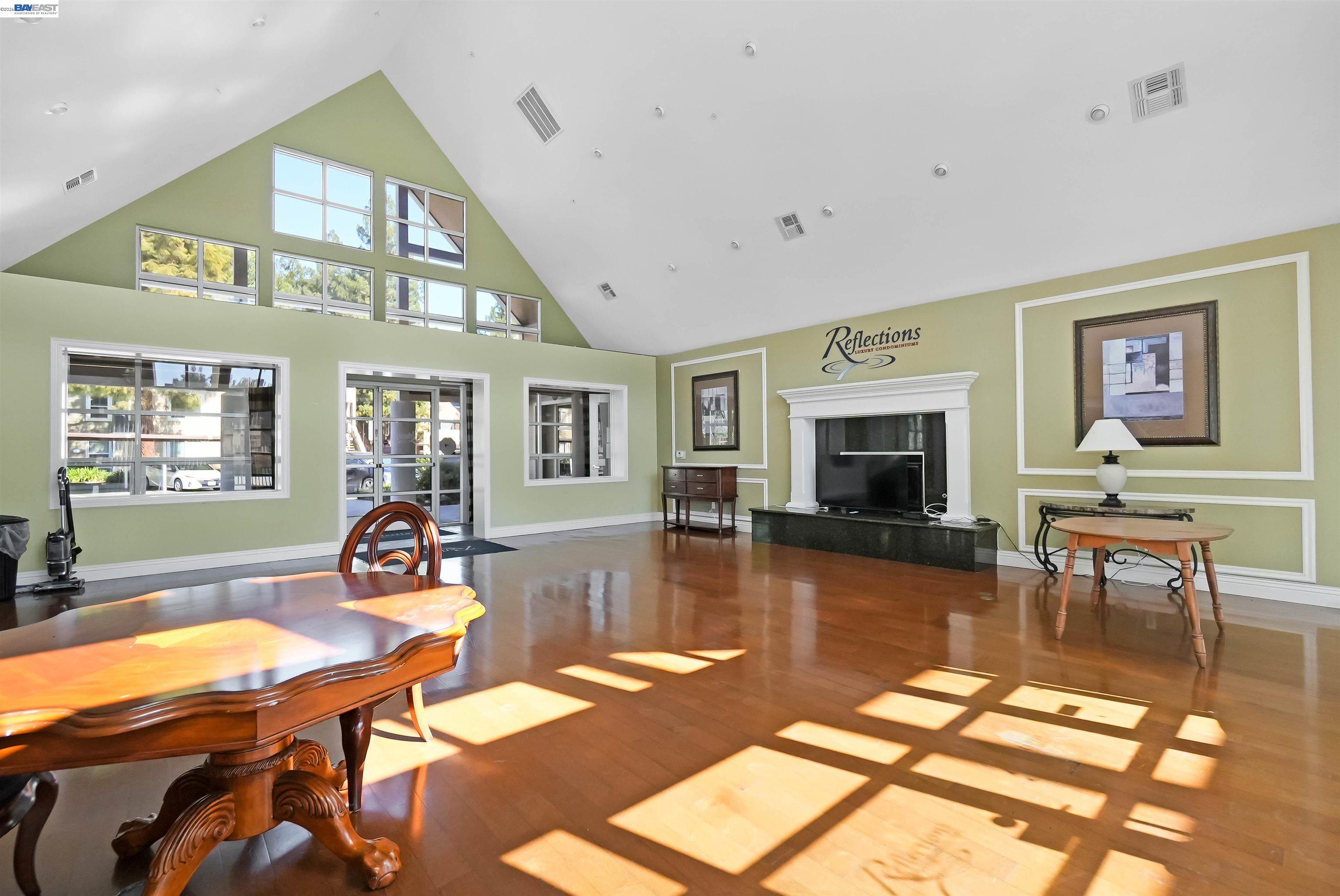 200 Reflections Drive, Unit 23 San Ramon, CA 94583 - Photo 49 of 56 a living room with furniture a fireplace and a flat screen tv