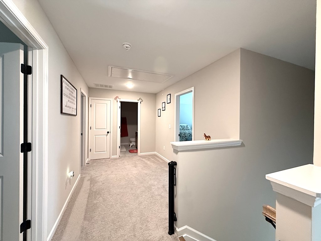 33 Sugar Maple Drive Fort Mitchell, AL 36856 - Photo 16 of 29 a view of hallway with furniture and a window