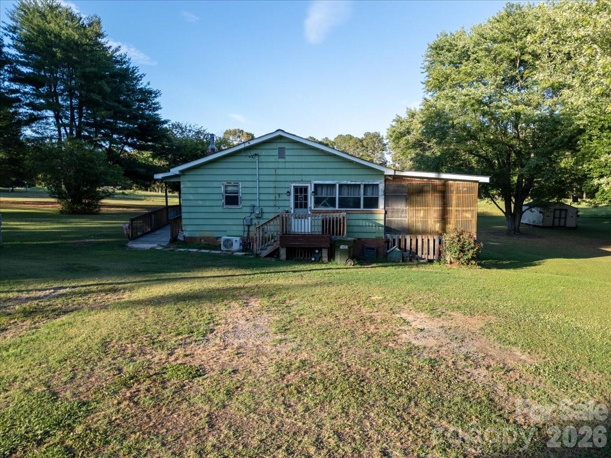 12282 Coyle Road Stanfield, NC 28163 - Photo 19 of 24 a front view of a house with garden