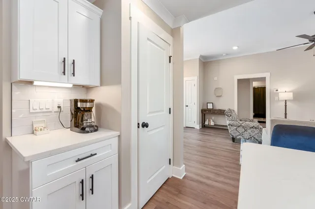 a kitchen with a sink and cabinets
