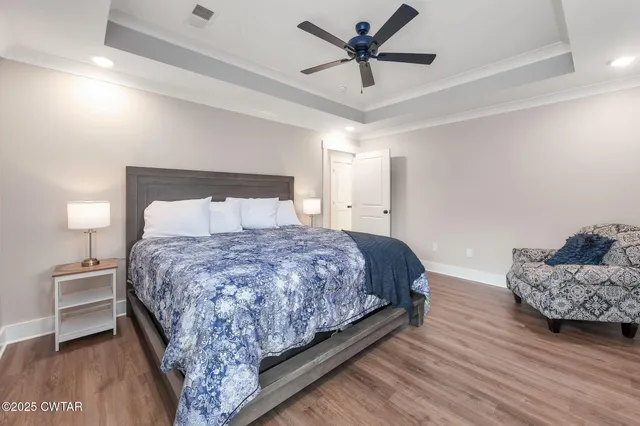 a bedroom with bed and window