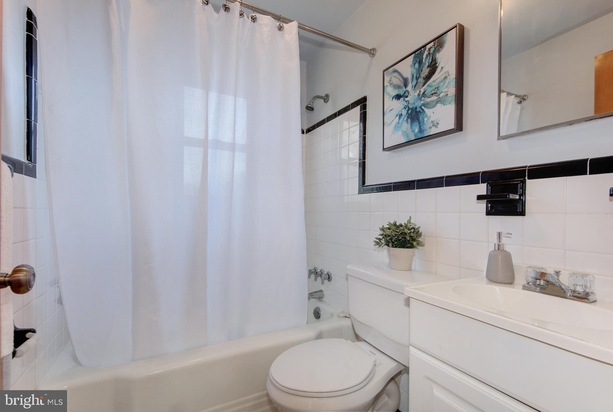 4846 Long View Road Temple Hills, MD 20748 - Photo 17 of 39 Ceramic Tile Hall Bathroom