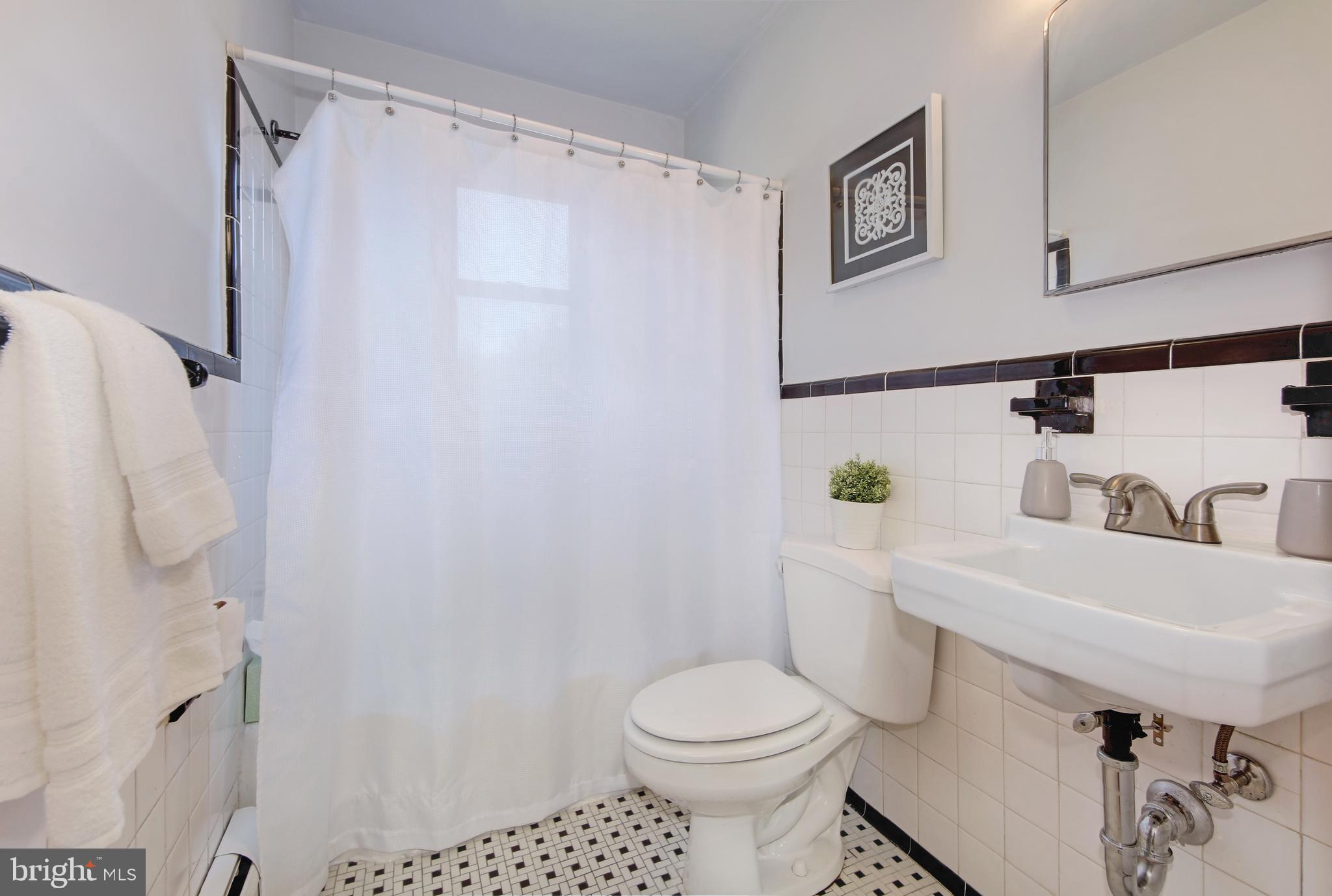 4846 Long View Road Temple Hills, MD 20748 - Photo 18 of 39 Ceramic Tile Hall Bathroom