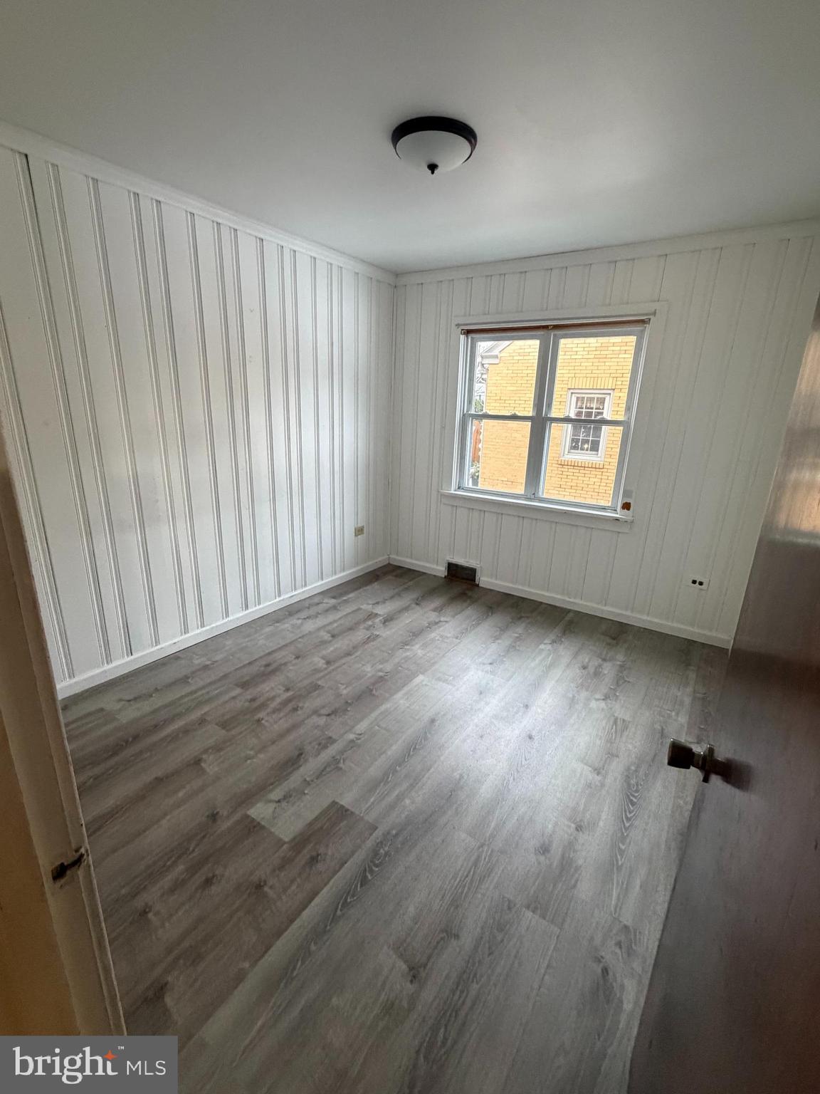 333 East Locust Street Lebanon, PA 17042 - Photo 11 of 17 an empty room with wooden floor and windows