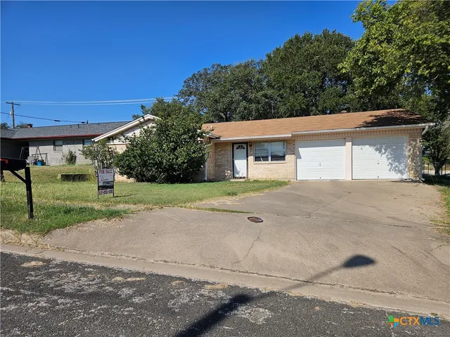 front view of a house with a street