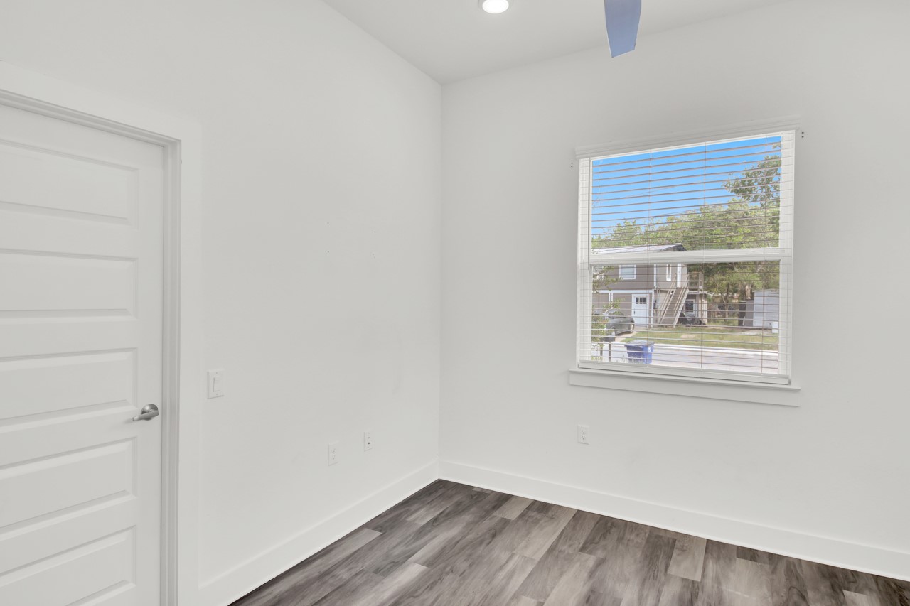6325 Ponca Street, Unit B Austin, TX 78741 - Photo 12 of 29 Spare room with wood finished floors, recessed lighting, and a ceiling fan
