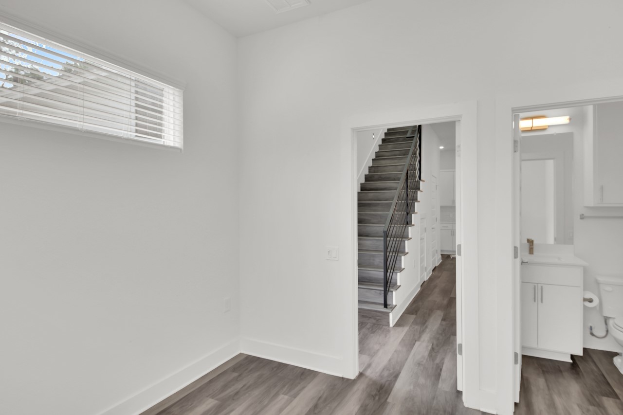6325 Ponca Street, Unit B Austin, TX 78741 - Photo 14 of 29 Staircase with wood finished floors