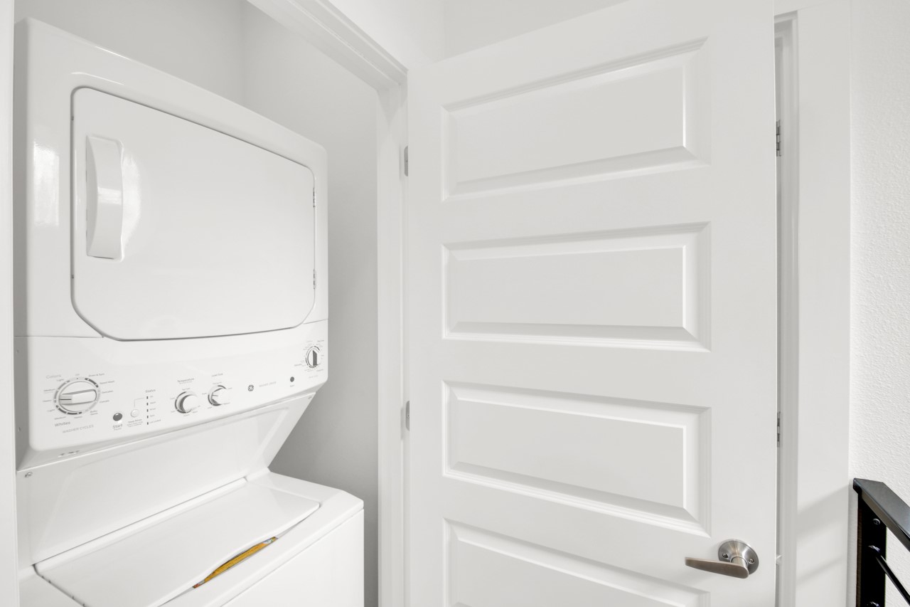 6325 Ponca Street, Unit B Austin, TX 78741 - Photo 19 of 29 Laundry area featuring stacked washer / drying machine