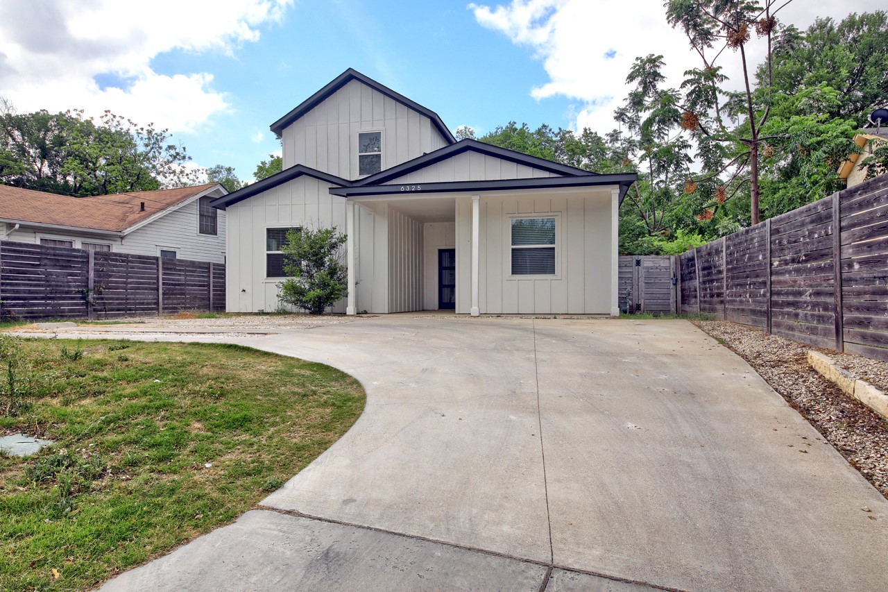 6325 Ponca Street, Unit B Austin, TX 78741 - Photo 29 of 29 View of front of house with board and batten siding and driveway
