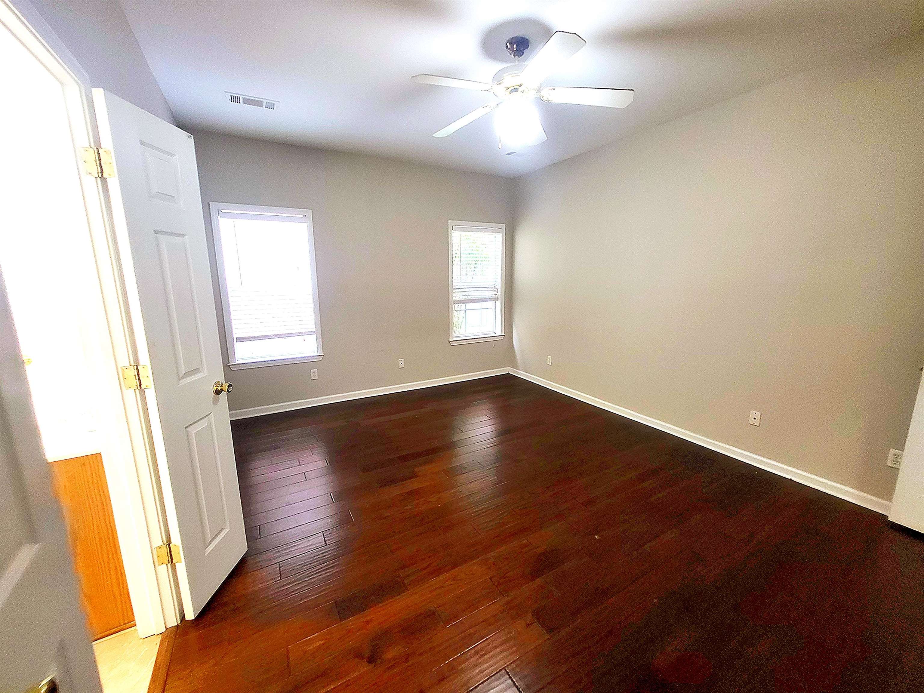 4567 Park Ridge Parkway Collierville, TN 38017 - Photo 12 of 23 Spare room featuring ceiling fan and wood-type flooring