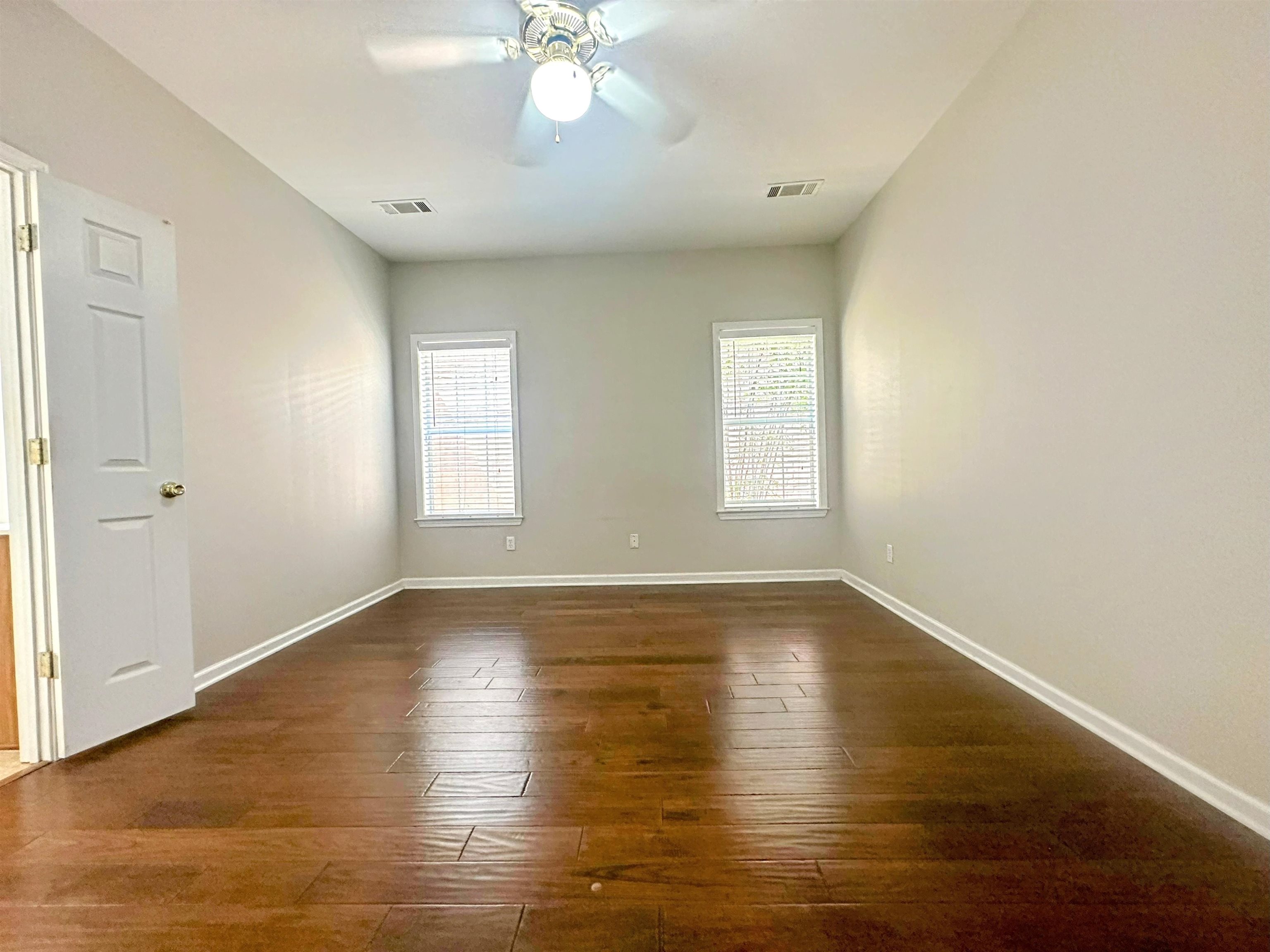 4567 Park Ridge Parkway Collierville, TN 38017 - Photo 13 of 23 Spare room featuring dark hardwood / wood-style floors, a wealth of natural light, and ceiling fan