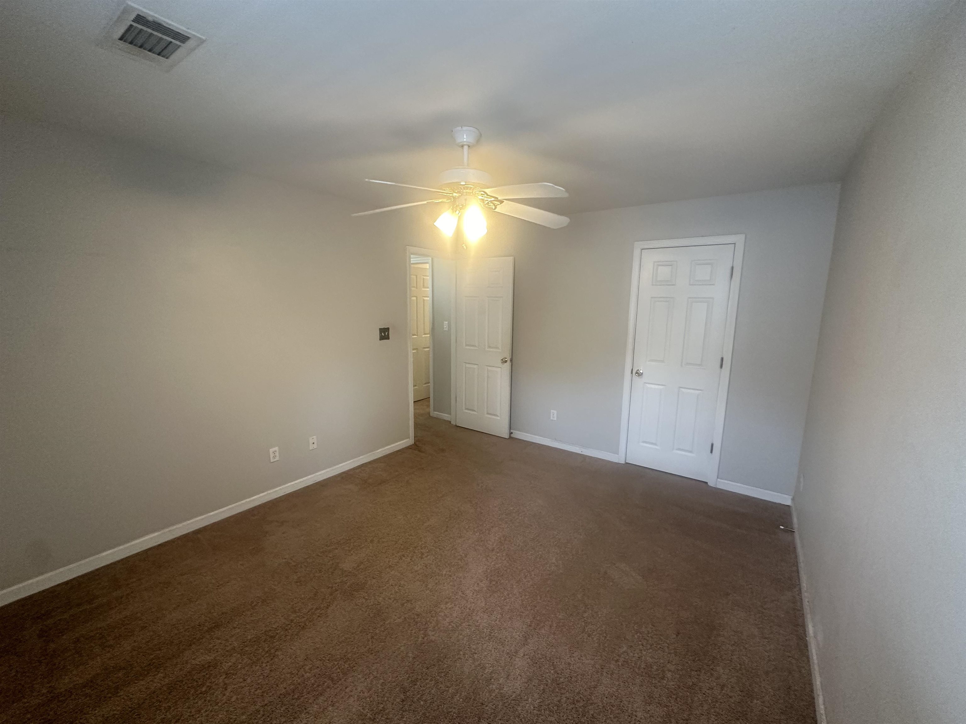 4567 Park Ridge Parkway Collierville, TN 38017 - Photo 17 of 23 Unfurnished bedroom featuring dark carpet and ceiling fan