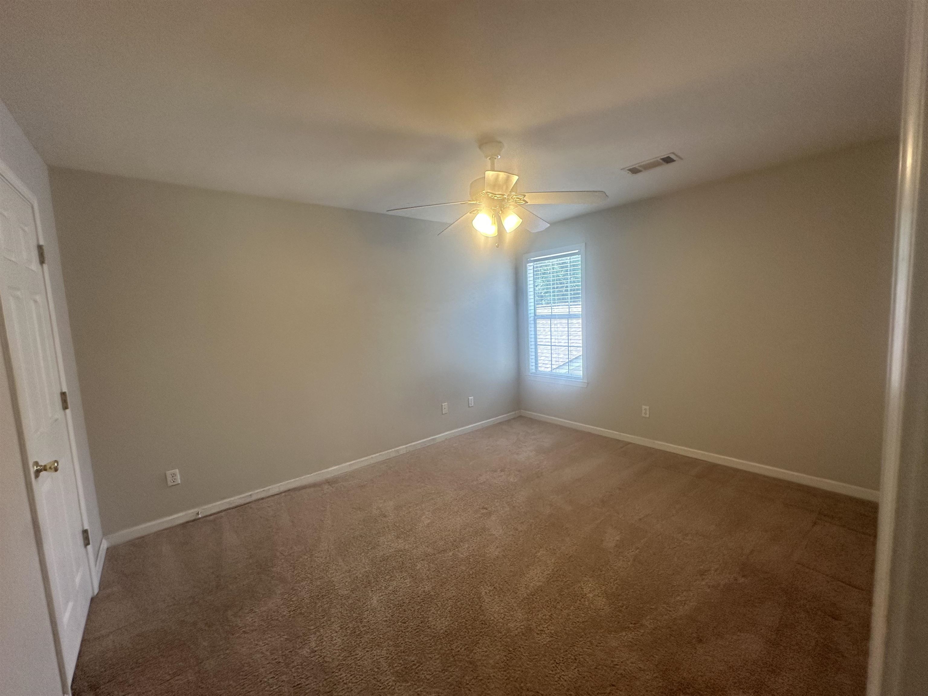 4567 Park Ridge Parkway Collierville, TN 38017 - Photo 18 of 23 Carpeted empty room with ceiling fan
