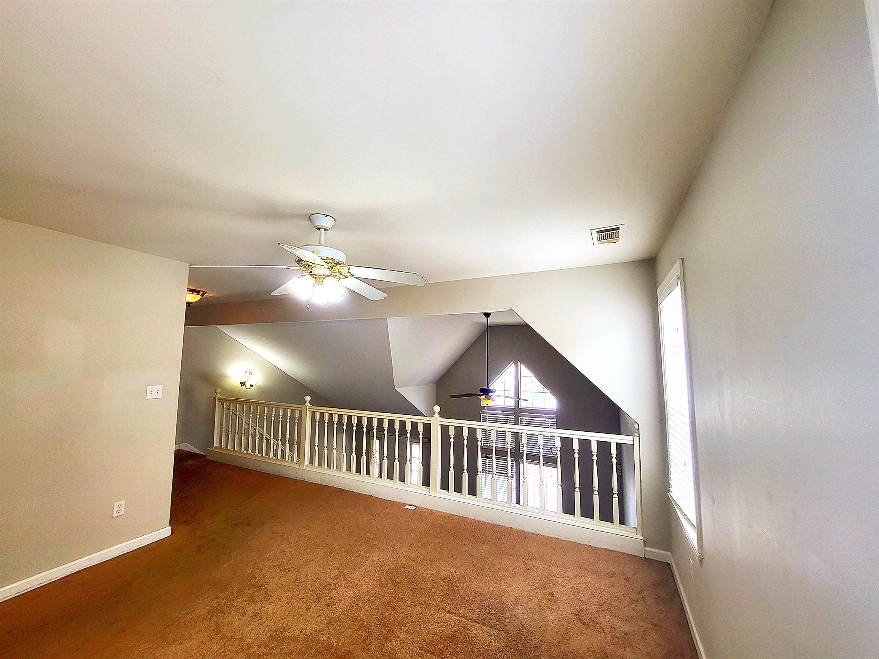 4567 Park Ridge Parkway Collierville, TN 38017 - Photo 21 of 23 Additional living space with carpet, ceiling fan, and lofted ceiling