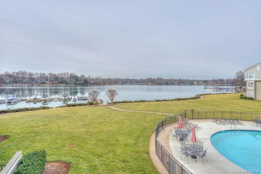 1332 Torrence Circle, Unit 1332 Davidson, NC 28036 - Photo 1 of 24 a view of a swimming pool with an ocean view