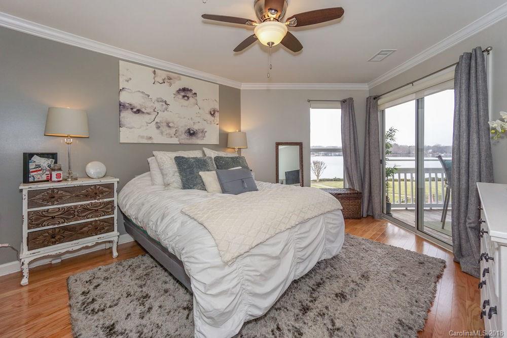 1332 Torrence Circle, Unit 1332 Davidson, NC 28036 - Photo 14 of 24 a bedroom with a large bed and a window