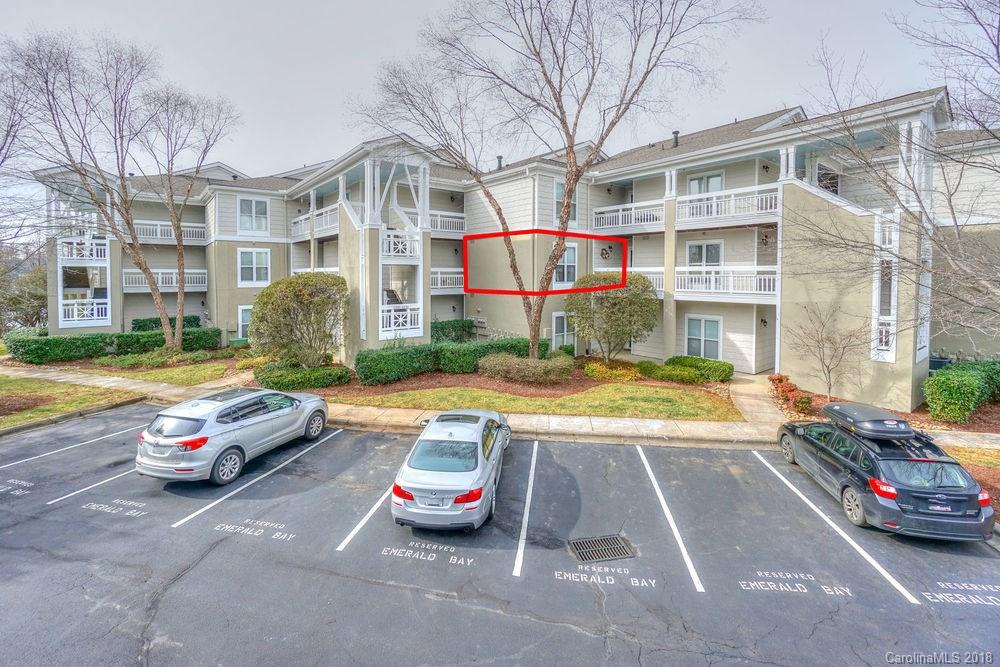 1332 Torrence Circle, Unit 1332 Davidson, NC 28036 - Photo 23 of 24 a view of a cars park in front of a building