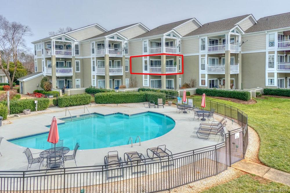 1332 Torrence Circle, Unit 1332 Davidson, NC 28036 - Photo 24 of 24 a swimming pool with outdoor seating and yard
