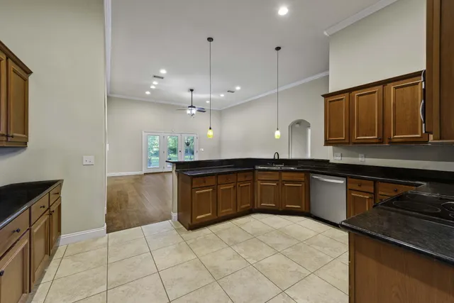 a kitchen with a sink and cabinets