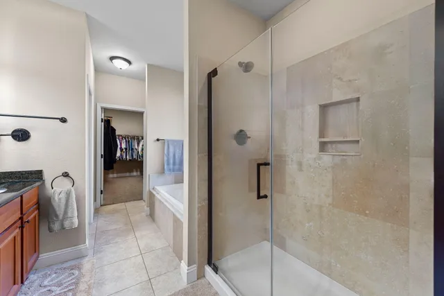 a bathroom with a shower and a sink
