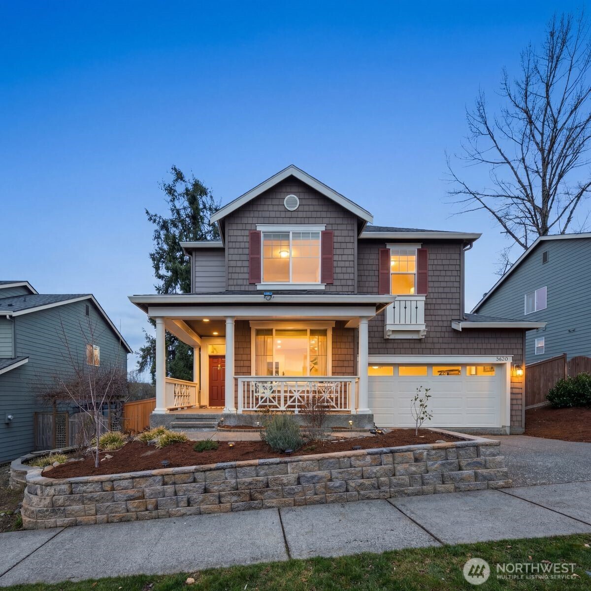 5620 Northeast 6th Place Renton, WA 98059 - Photo 1 of 37 a front view of a house with garden