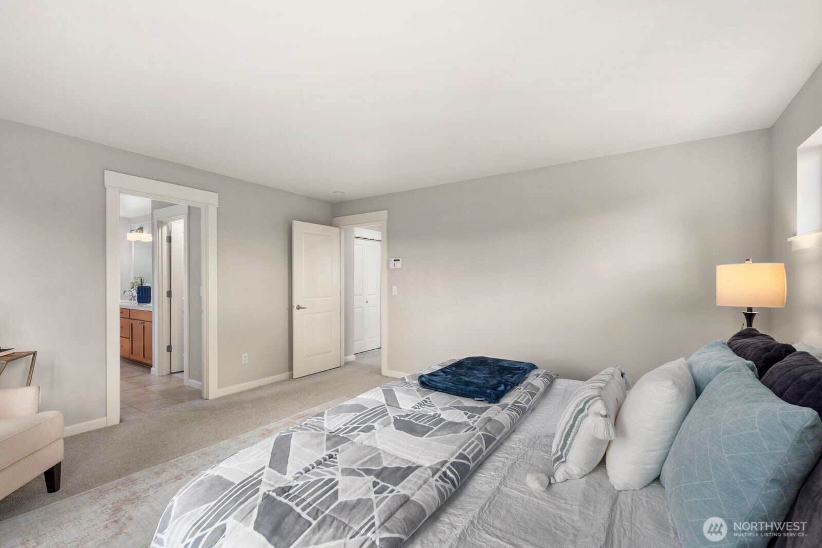 5620 Northeast 6th Place Renton, WA 98059 - Photo 21 of 37 a bedroom with a bed and a couch