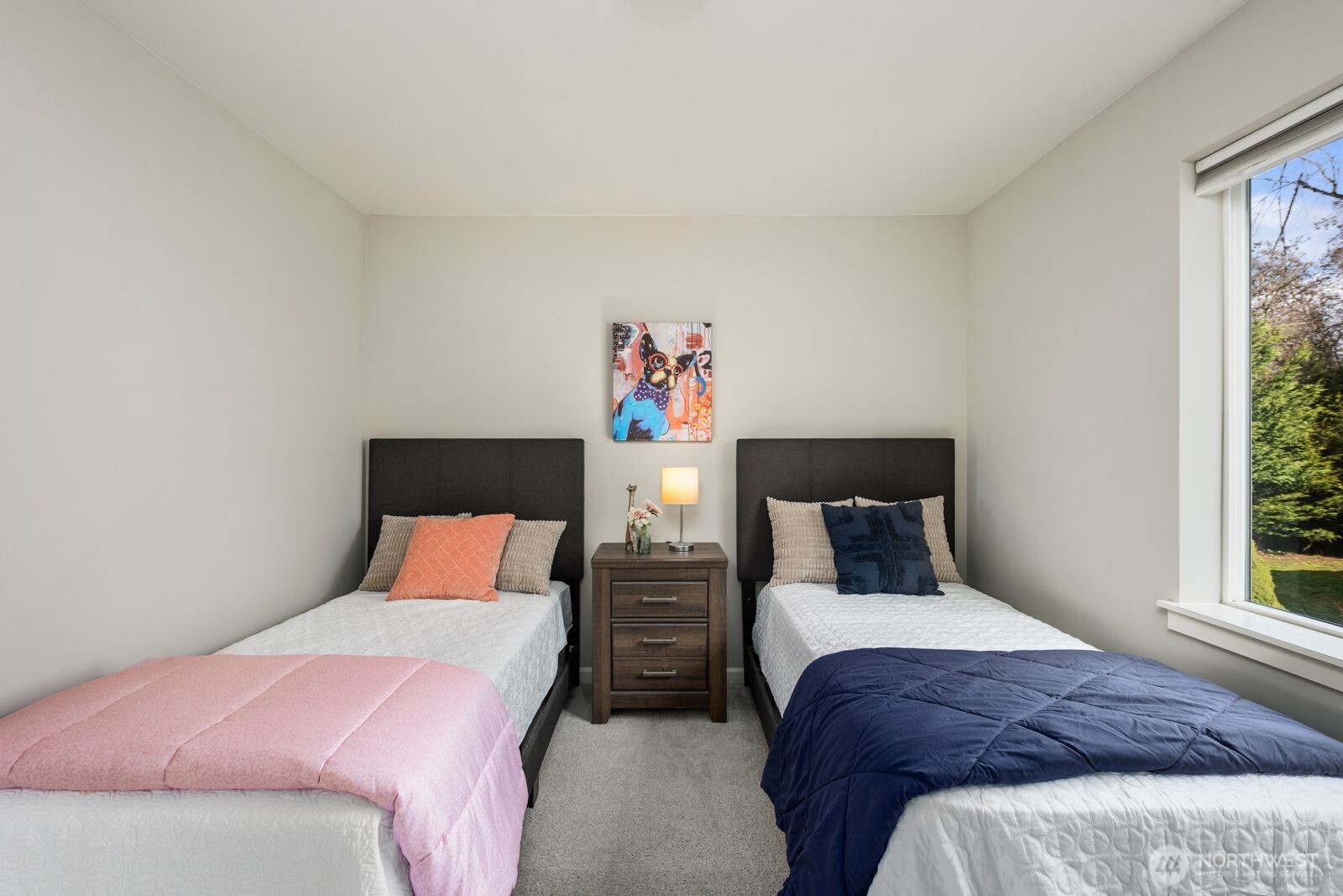 5620 Northeast 6th Place Renton, WA 98059 - Photo 24 of 37 a bedroom with two beds and a large window