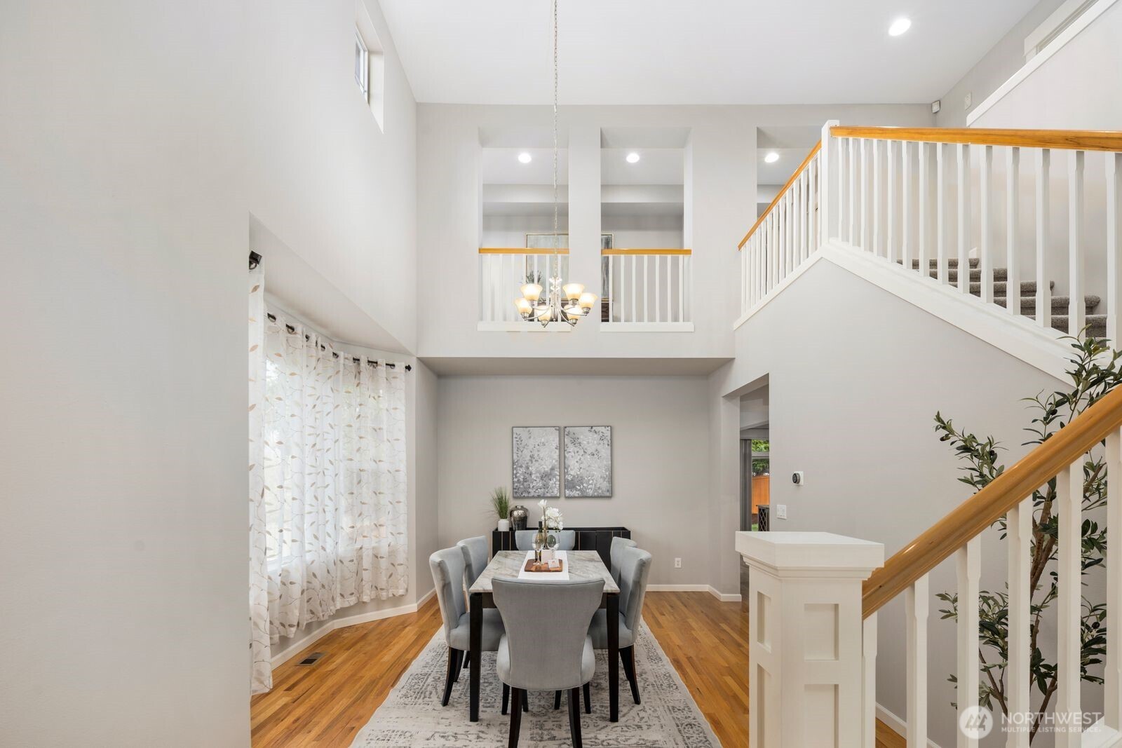 5620 Northeast 6th Place Renton, WA 98059 - Photo 5 of 37 a view of a dining room with furniture window and wooden floor