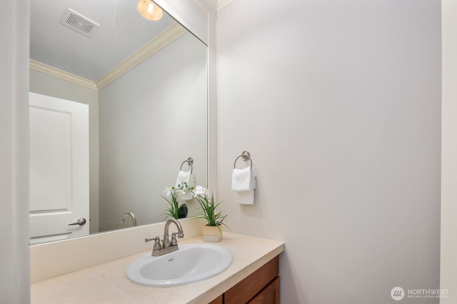 5620 Northeast 6th Place Renton, WA 98059 - Photo 7 of 37 a bathroom with a sink and a mirror