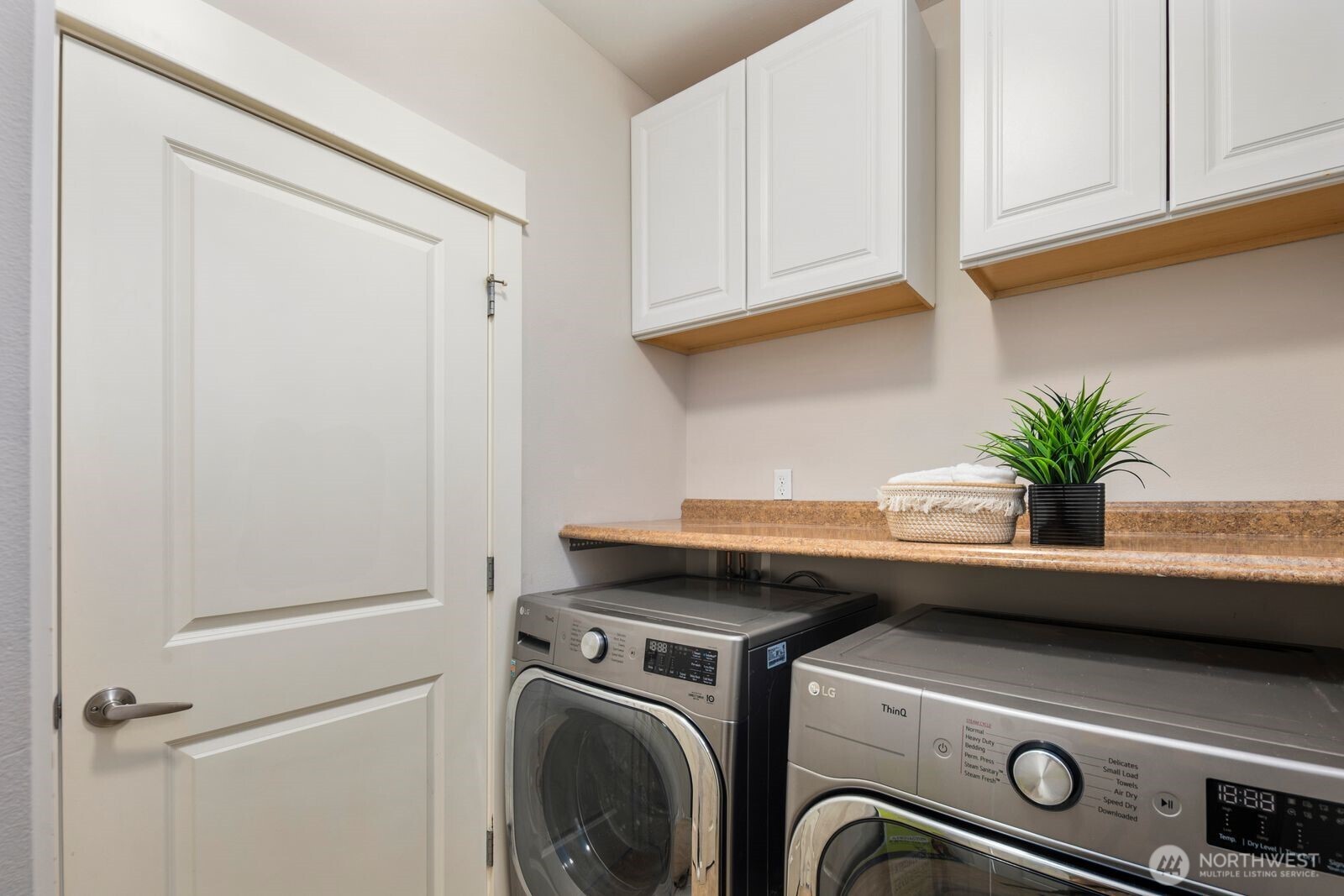 5620 Northeast 6th Place Renton, WA 98059 - Photo 8 of 37 a utility room with dryer and washer