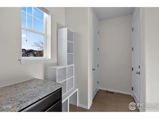a kitchen with kitchen island a counter top space and a sink