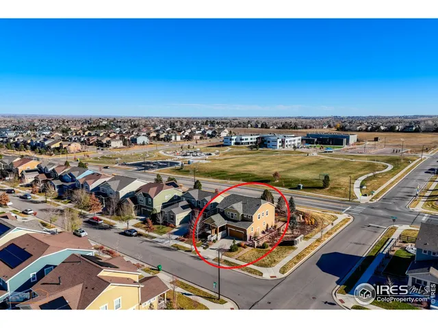 an aerial view of a house with a ocean view