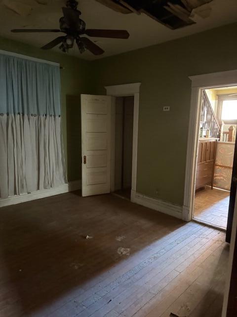1828 Oliver Street Whiting, IN 46394 - Photo 32 of 37 an empty room with wooden floor chandelier fan and windows