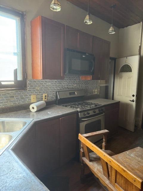1828 Oliver Street Whiting, IN 46394 - Photo 34 of 37 a kitchen with a sink stove and cabinets