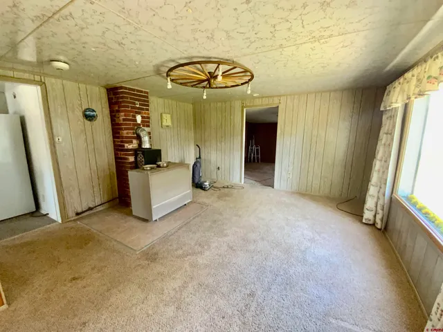 a view of a hallway with a bathroom