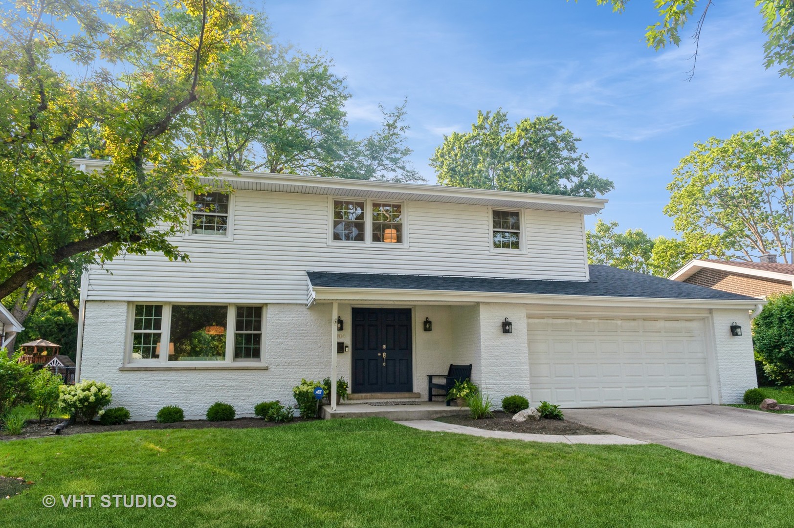 1704 Executive Lane Glenview, IL 60026 - Photo 1 of 21 a front view of a house with a yard and garage